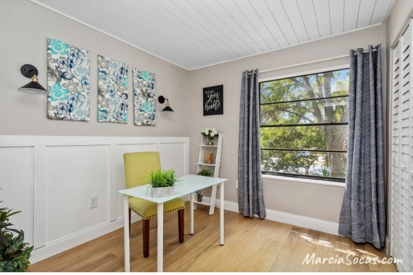 Room with shiplap ceiling