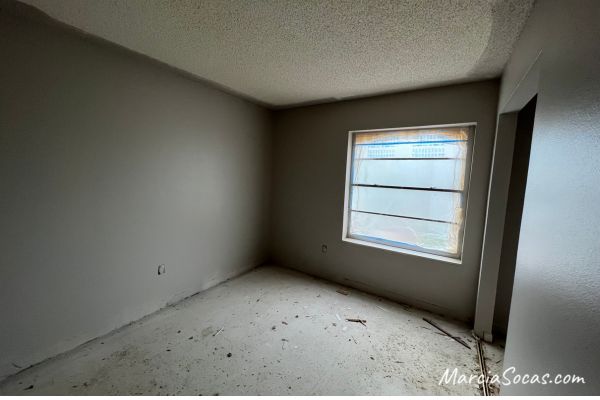 Before photo showing popcorn ceiling
