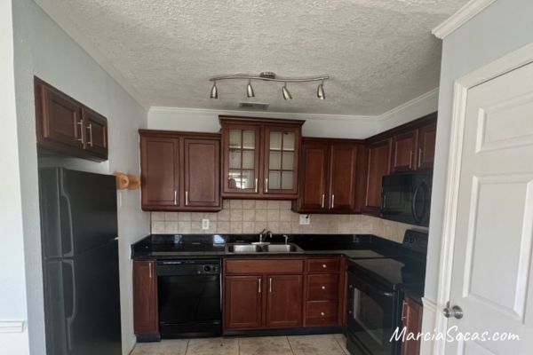 dark kitchen before diy faux marble countertops