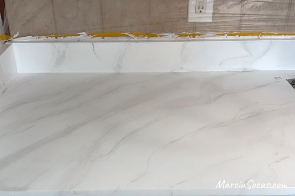 white countertop with gray veins, faux marble look