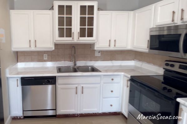 photos of kitchen renovation in condo, how to paint kitchen countertops to look like marble