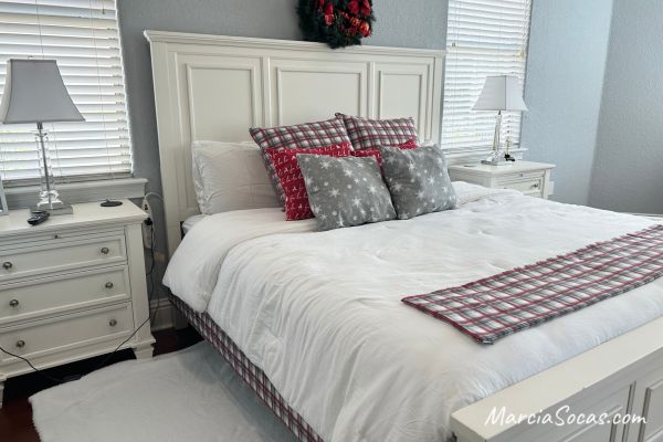 bed with plaid christmas decor