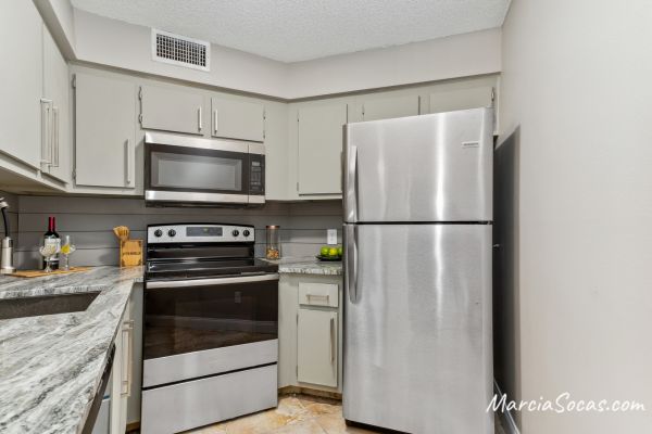 small kitchen with shiplap backsplash