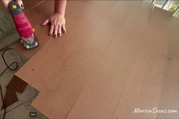 trimming the door edges using a handheld circular saw