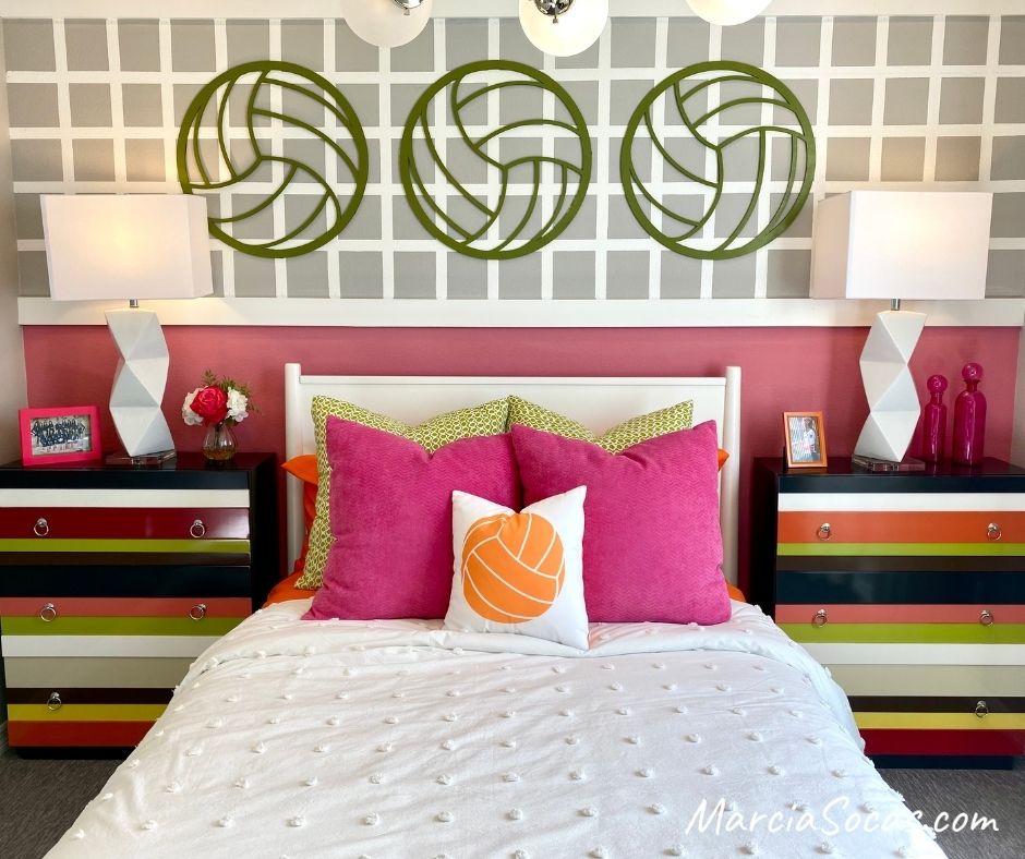 Bedroom with volleyball decor, bright colored pillows, and volleyball pillow in this volleyball themed room