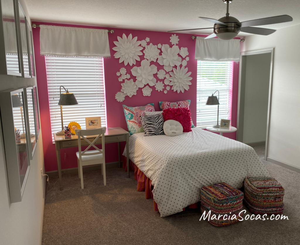 floral decor on bright pink accent wall