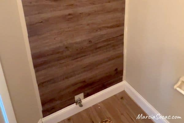 finishing off vinyl plank accent wall behind toilet