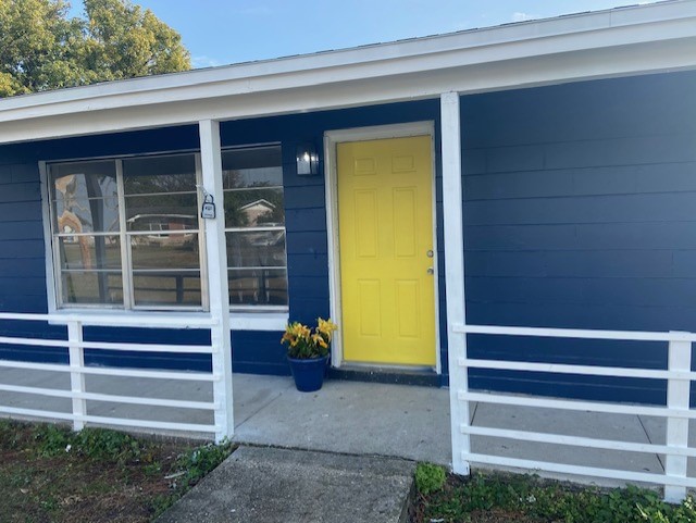 Home painted Salty Dog blue with Daisy yellow door