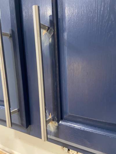 cabinet holes filled with wood putty