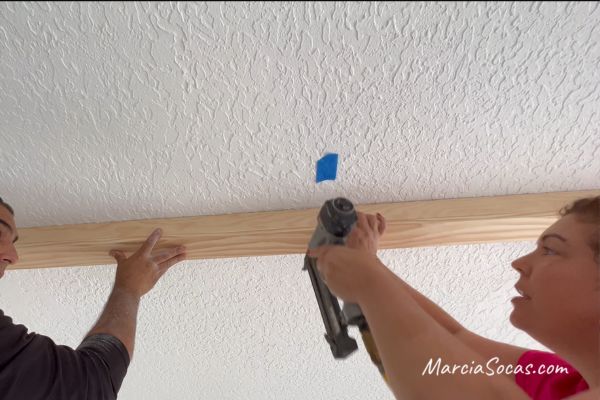 attaching u-shaped wood beams to ceiling